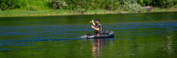 Fishermen out in the water with fly fishing