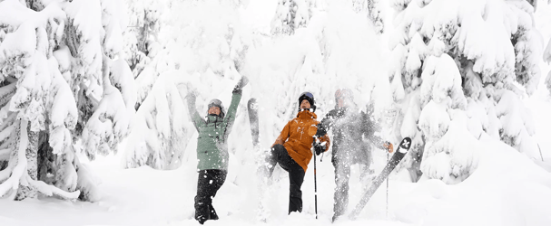 Two people skiing in the loose snow