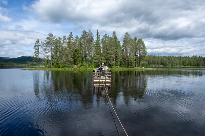Family on a raft in Kolosjøen