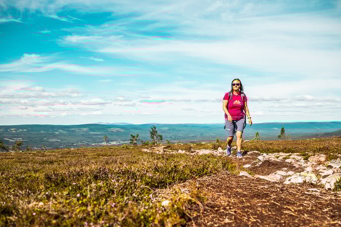 Lady on a trail in the mountains