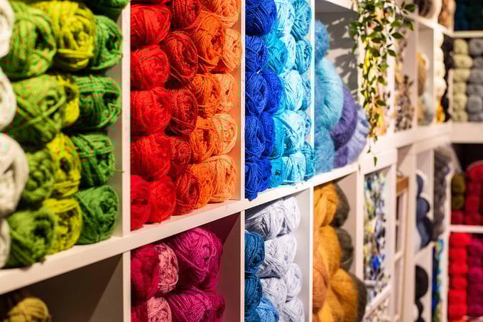 Shelf with balls of yarn in bright colours